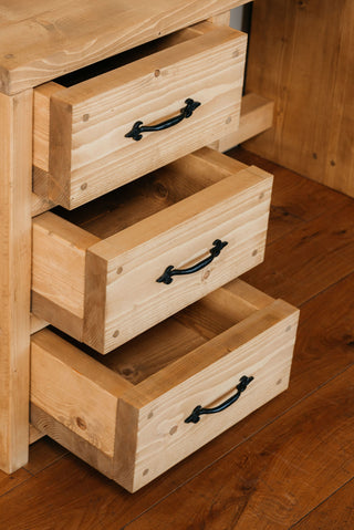 Upgrade your workspace with the Marina Solid Wood Rustic Desk: A harmonious blend of style and functionality, featuring convenient storage compartments and drawers.