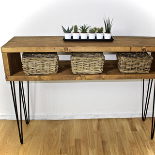 Welcome guests with the Holmestead Industrial Console Table, a rustic hallway piece crafted from reclaimed wood and metal. Handmade for unique charm.