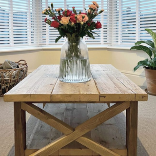 Introducing the Winford Reclaimed Solid Wood Coffee Table: A rustic masterpiece with a storage shelf, crafted from reclaimed wood to bring timeless charm and practical elegance to your living room.