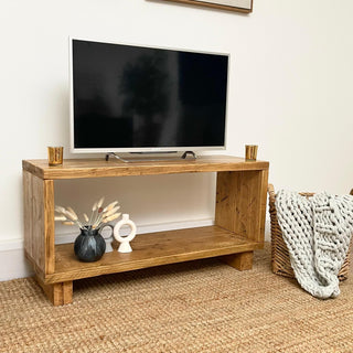 Elevate your space with the Cadland Reclaimed TV Media Unit, featuring open storage for electronics, crafted from reclaimed wood for rustic charm.