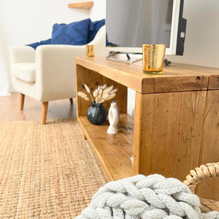 Elevate your home with the Cadland Reclaimed TV Media Unit, showcasing open storage for electronics. Handmade from reclaimed wood for rustic charm.