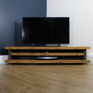 The Holbury TV unit, a rustic wooden entertainment unit, is perfect for your living room. Crafted from solid wood, this corner TV unit features natural elegance and sturdy construction.
