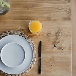 Embrace modern rustic charm with our bespoke solid wood rustic dining table. Handmade to order, it embodies sustainability and adds a touch of farmhouse elegance to any modern home.