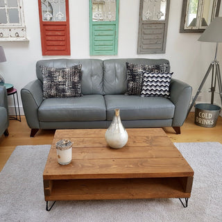 Discover the Frogham Rustic Industrial Coffee Table with Storage. Handcrafted from solid wood with industrial metal feet for added style and durability.