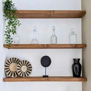 Enhance your space with this stylish Set of 3 Wall-Mounted Floating Shelves. Featuring a rustic design, these shelves provide versatile storage for your bathroom, kitchen, and living room.