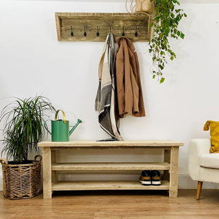Embrace rustic elegance with our Ryde shoe rack table, handcrafted in Hampshire from reclaimed and distressed wood. This solid wood end table doubles as a shoe storage cabinet, featuring compartments and shelves for organized storage.