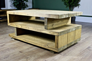 The Ashton Coffee Table: a functional and practical addition to your living room furniture. Its rustic design, crafted from chunky solid wood, adds warmth and character to your space.