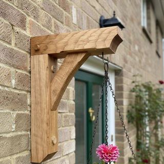 Elevate your garden with the Gallow Solid Oak Outdoor Hanging Basket Bracket, a durable and stylish addition for showcasing your hanging plants. Handcrafted from solid oak for lasting charm.