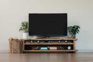 Introducing the Norleywood TV unit, a rustic wooden entertainment unit crafted to enhance your living room decor. Made from solid wood, featuring a shelf for storage, providing ample space for your media essentials.
