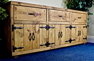 The Chelmorton Sideboard is a unique living room and dining room sideboard cabinet crafted from solid wood. Handmade with attention to detail, it features doors and drawers for ample storage. This versatile piece can be made in bespoke sizes to suit your space and storage needs.