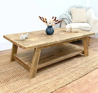 Elevate your living room with the Yarmouth coffee table, crafted from reclaimed timber for a natural, rustic charm. This farmhouse-style coffee table features solid wood construction and a waxed finish, adding warmth and character to your living space. Explore the beauty of salvaged and recycled wood, bringing sustainability and style into your home decor. Perfect for those seeking a wooden coffee table with a timeless appeal