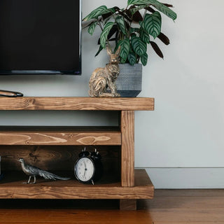 Transform your living room with the Norleywood TV unit, a rustic wooden entertainment unit crafted to elevate both style and functionality. Made from solid wood, this high TV unit features a shelf for storage.