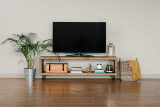 Introduce rustic charm to your living room with the Romsey TV unit, a handmade wooden entertainment unit designed for both style and functionality. Crafted from solid wood, this bespoke TV unit features a shelf for storage, making it a versatile console unit for your TV media needs.