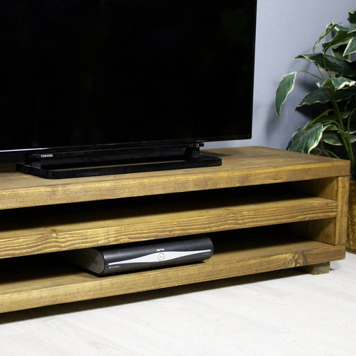 Solid wood tv unit featuring two shelves for all your media equipment in a chunky rustic style. Handcrafted in the New Forest.
