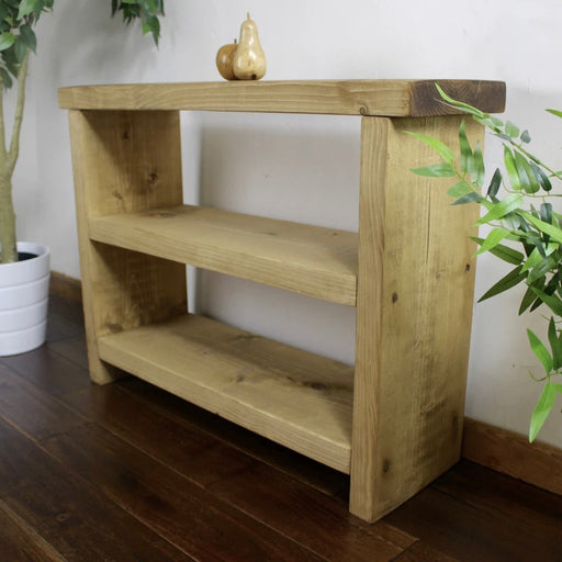 Solid wood side table in a medium oak finish, featuring two shelves for added storage, in a chunky rustic style. Handmade in the New Forest.