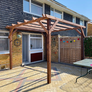 Introducing the Wooden Eco Pergola: Elevate your outdoor living space with this unique garden feature, providing shade over your dining area or pathway while inviting climbing plants to thrive.