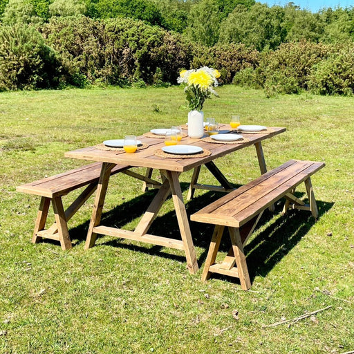 Reclaimed solid wood outdoor patio dining table set, finished in a chunky rustic style. Handcrafted in the New Forest.