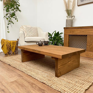The charming Burley Small Solid Wood Rustic Low Coffee Table, handcrafted from reclaimed timber for a timeless addition to any living space.