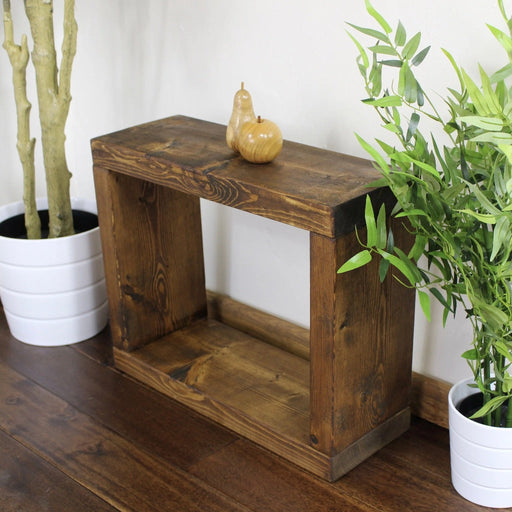 Solid wood single cube table, in a dark oak stain, finished in a chunky rustic style, can be used as a table or to display some of your favourite home accessories. Handcrafted in the New Forest.