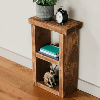 Enhance your space with the rustic charm of the solid wood small Hinton side table, perfect for adding warmth and character to any room.