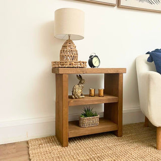 The Bartley Side Table: Handcrafted in the UK, this fully assembled piece features a functional shelf for extra storage in your living room, bedroom, or hallway. 