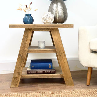 Discover the rustic charm of our reclaimed Yarmouth side table, featuring a shelf for convenient storage. This small table is perfect for living rooms, crafted from solid, recycled wood with a distressed and natural finish.