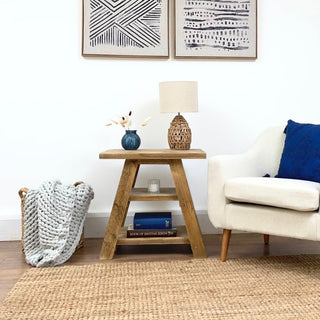 Reclaimed Yarmouth side table, featuring a shelf for storage. Perfect for living rooms, this small table is crafted from solid, recycled wood, adding character to any space with its distressed and natural wood finish. Ideal as an accent table or end table.