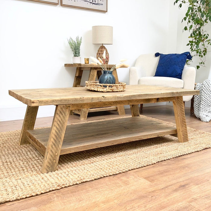 Reclaimed solid wood coffee table in a clear finish, featuring a  shelf underneath for magazines etc, bringing a natural influence to any room with its chunky rustic style. Handcrafted in the New Forest.