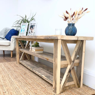 The Winford Solid Wood Reclaimed TV Unit with Storage: Elevate your entertainment space with this bespoke. Featuring a distinctive cross design and a dedicated shelf for soundbar and audio equipment, it blends natural wood beauty with custom functionality.