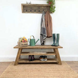 Introducing the Yarmouth Reclaimed Wooden Shoe Rack Bench: Elevate your entryway with this rustic yet functional piece, handcrafted from reclaimed wood to provide both storage and seating in style.