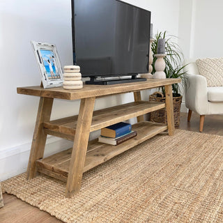 Introducing the Yarmouth Handmade Reclaimed Wood TV Unit with Shelf: Elevate your entertainment area with this rustic yet functional piece, handcrafted from reclaimed wood to add character and charm to your home.