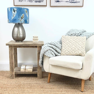Introduce rustic charm to your living room with the Ryde side table, a farmhouse-inspired piece crafted from solid wood. This rustic side table adds a touch of modern farmhouse style to any cottage or living room decor. Made from natural wood, it exudes warmth and character, perfect for complementing your space.