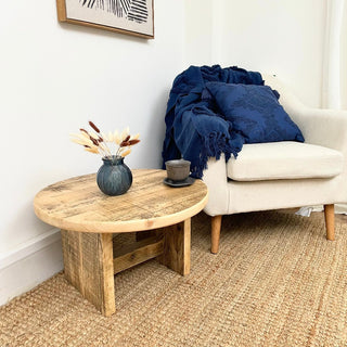 Introduce rustic character with our Handcrafted Reclaimed Low Round Coffee Table: Fashioned from salvaged wood, each piece boasts weathered charm and unique appeal.