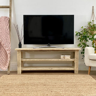 Bring sustainable charm to your media area with the Ryde Handcrafted Reclaimed Wood Media Unit: Featuring salvaged wood construction and open shelves, it's an eco-friendly addition to your home.