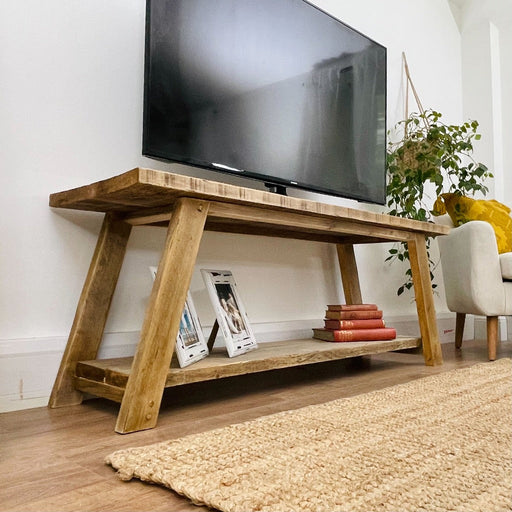 Reclaimed solid wood TV unit featuring a shelf underneath for additional storage, bringing a natural influence to any room with its chunky rustic style. Handcrafted in the New Forest.
