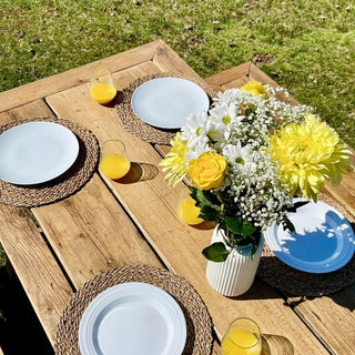 Explore the eco-friendly allure of the Harlow Handcrafted Garden Dining Table, fashioned from upcycled wood for sustainable outdoor entertaining
