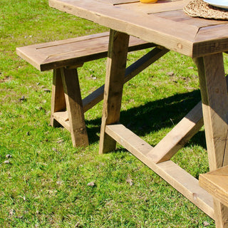 The timeless elegance of the Harlow Handcrafted Reclaimed Wooden Garden Dining Table. Crafted from upcycled wood for eco-friendly outdoor dining.
