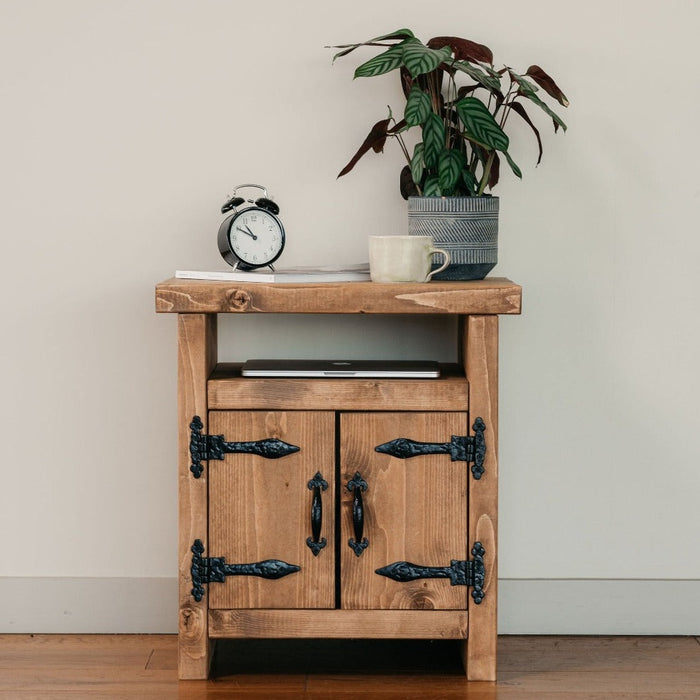 Solid wood bedside table featured in a dark oak finish, in a chunky rustic style. Handcrafted in the New Forest.