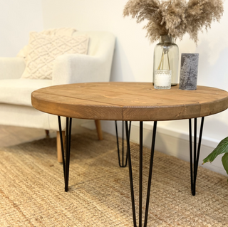 The Hampton Handmade Rustic Round Industrial Coffee Table with metal hairpin legs. Crafted from solid wood, blending rustic charm with modern design.