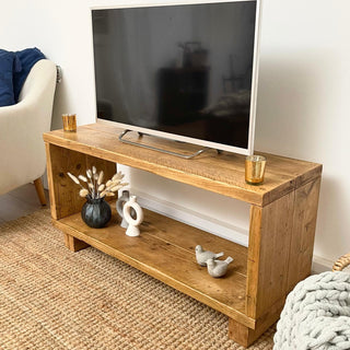 Upgrade your home with the Cadland Reclaimed TV Media Unit, offering open storage for electronics. Handmade from upcycled wood.