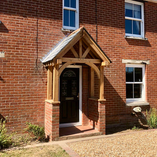 Introducing the Solid Oak Ivy Porch Kit: Elevate your home's entrance with timeless craftsmanship and enduring beauty, courtesy of hand-cut rafters and meticulous joinery