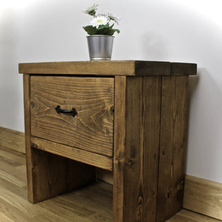 Complete your farmhouse-inspired bedroom with the Rustic Portmore Bedside Table: Featuring storage drawers, it adds charm and functionality to your farmhouse decor.