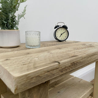 Explore the rustic charm of our reclaimed Winford side table, perfect for living room decor. Crafted from recycled and distressed solid wood, this small accent table adds warmth and character to any space.