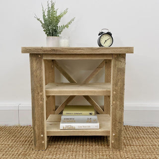 Introduce rustic elegance to your living room with our reclaimed Winford side table. Perfect as an end table or small table, it embodies the natural beauty of reclaimed wood, making it an ideal addition to your home decor.